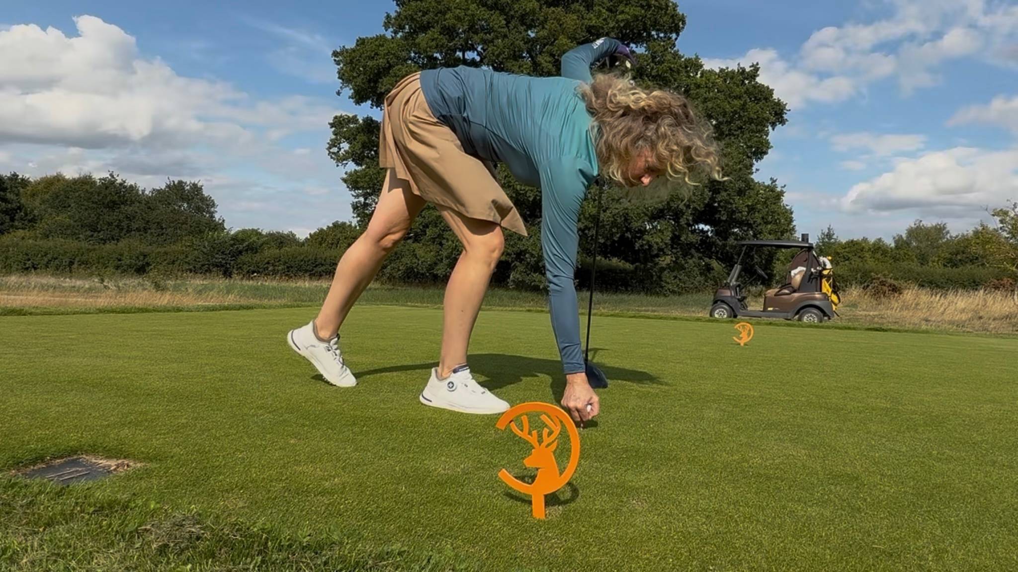 Katie Dawkins teeing the ball up
