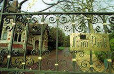 The main entrance and lodge house to Friar Park, Oxfordshire, pictured in 1999. Credit: Alamy