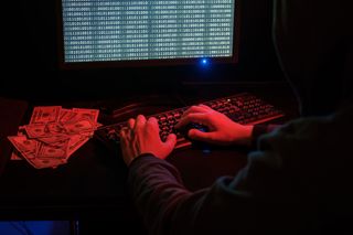 Cyber criminal extorting people at their terminal for cash