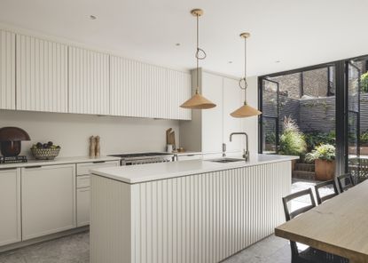 kitchen extension with ribbed island and copper lights