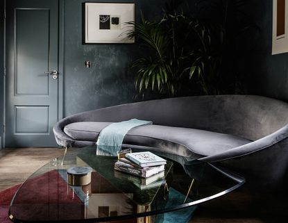 A curving sofa in the small living room
