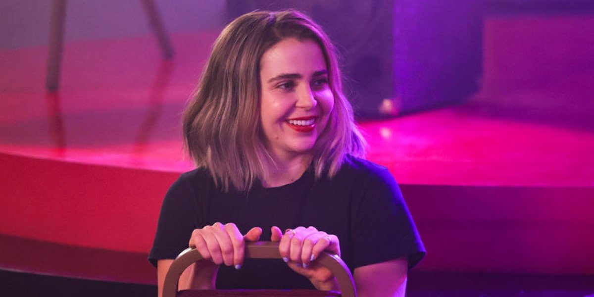 mae whitman sitting in a chair backwards on good girls season 3