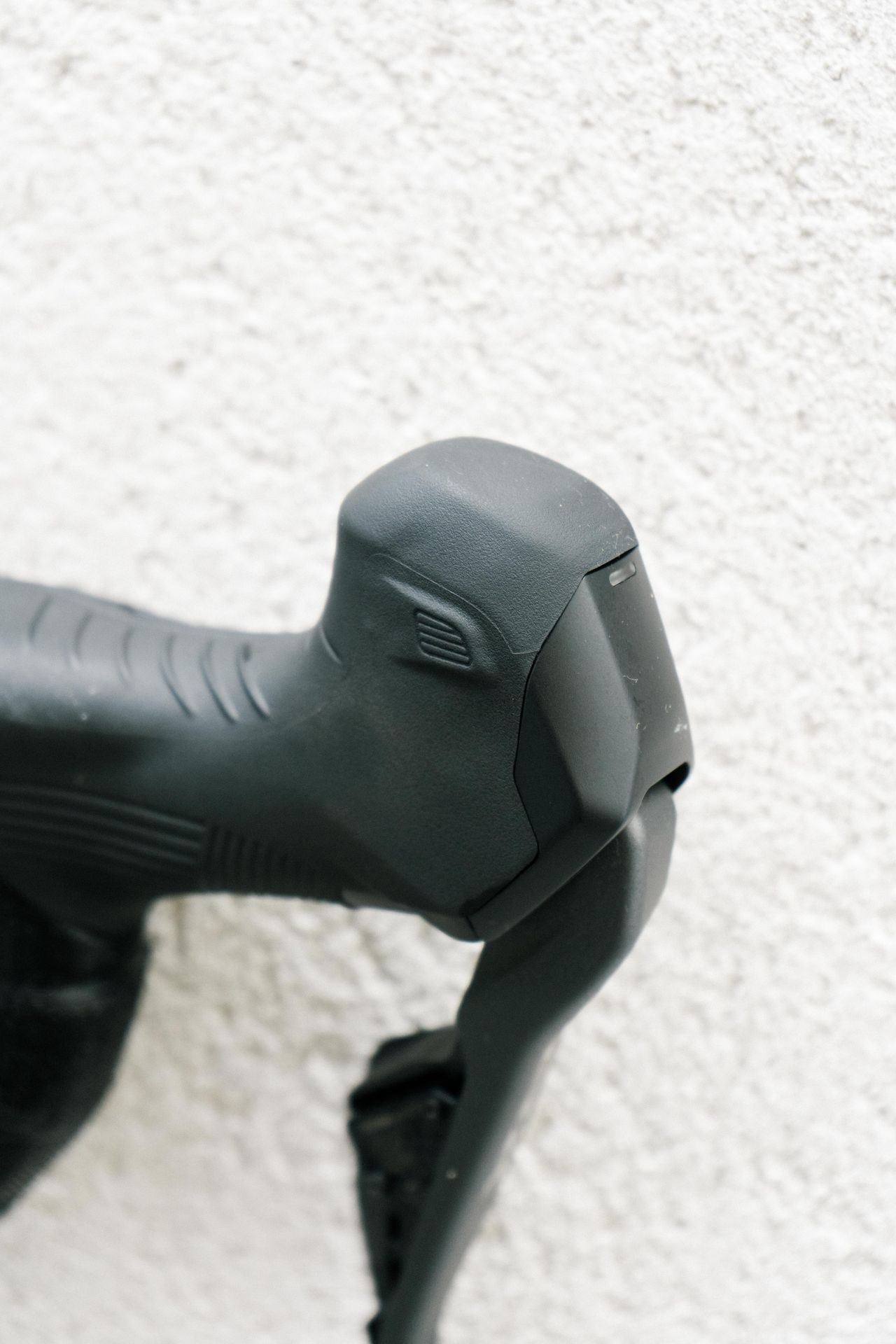 A close up of a grey shifter hood