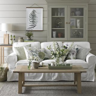 pale green and white living room with botanical theme