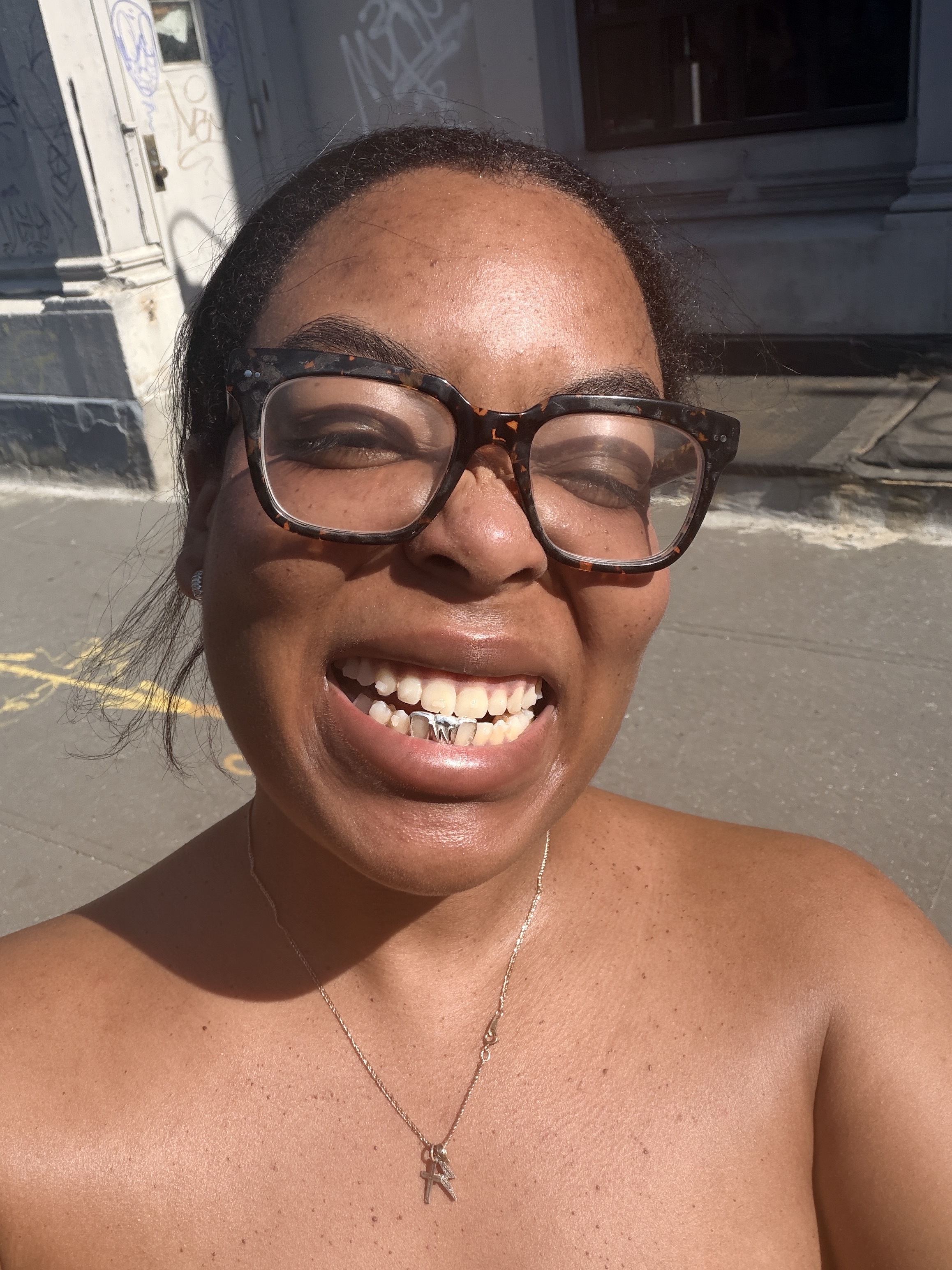 Ariel Baker wearing silver grillz