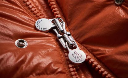 Close up of zip on red Moncler Maya puffer