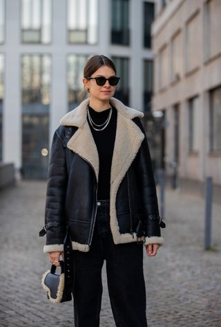 a photo of a woman wearing the italian bag brand atp atelier