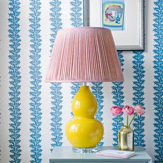 Oversized yellow table lamp with pink shade