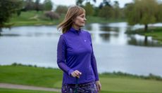 Alison Root wears the Famara Sheer Sleeve Golf Shirt