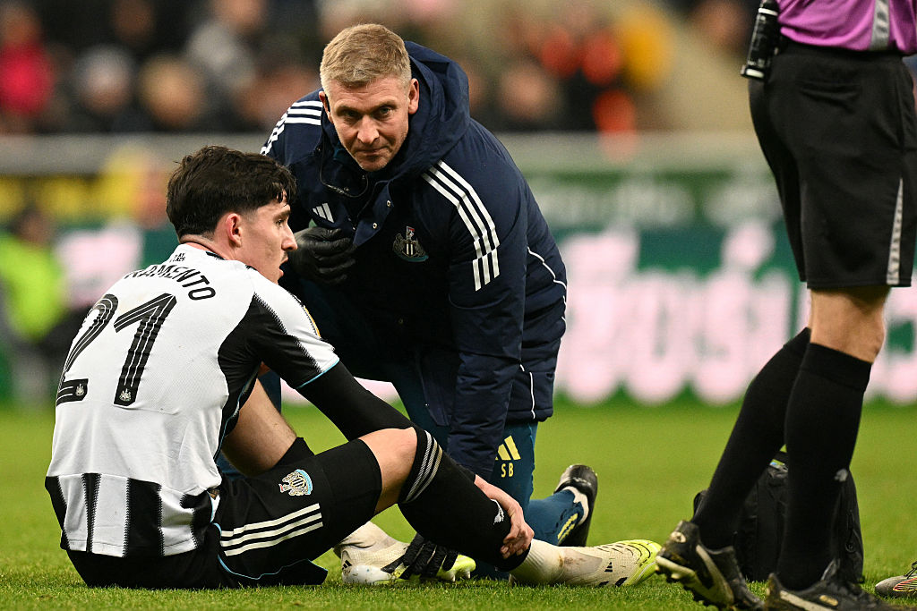 Newcastle United's English defender #21 Tino Livramento (L) gets attention for an injury before going off during the English League Cup quarter-final football match between Newcastle United and Fulham at St James' Park in Newcastle-upon-Tyne, north east England on December 17, 2025. (Photo by Oli SCARFF / AFP) / RESTRICTED TO EDITORIAL USE. No use with unauthorized audio, video, data, fixture lists, club/league logos or 'live' services. Online in-match use limited to 120 images. An additional 40 images may be used in extra time. No video emulation. Social media in-match use limited to 120 images. An additional 40 images may be used in extra time. No use in betting publications, games or single club/league/player publications. /