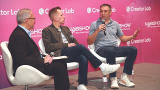 Juan Reyes, left, of the 8K Association speaks with Greg Ciaccio of IMAX and Mike Smith of Wavelet Consulting.