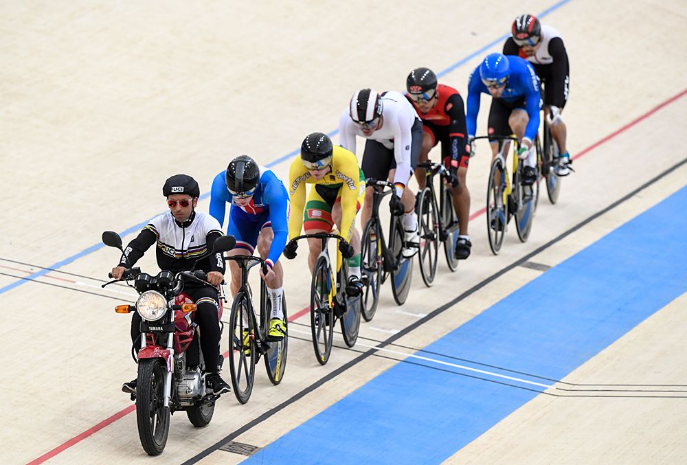 Cyclists compete in the men's Keirin first round during the Tissot UCI Track Cycling World Cup