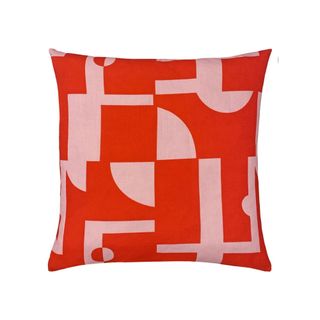 A pink and red abstract outdoor cushion