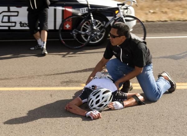 Scott Nydam is assisted by BMC staff following his Tour of the Gila crash.