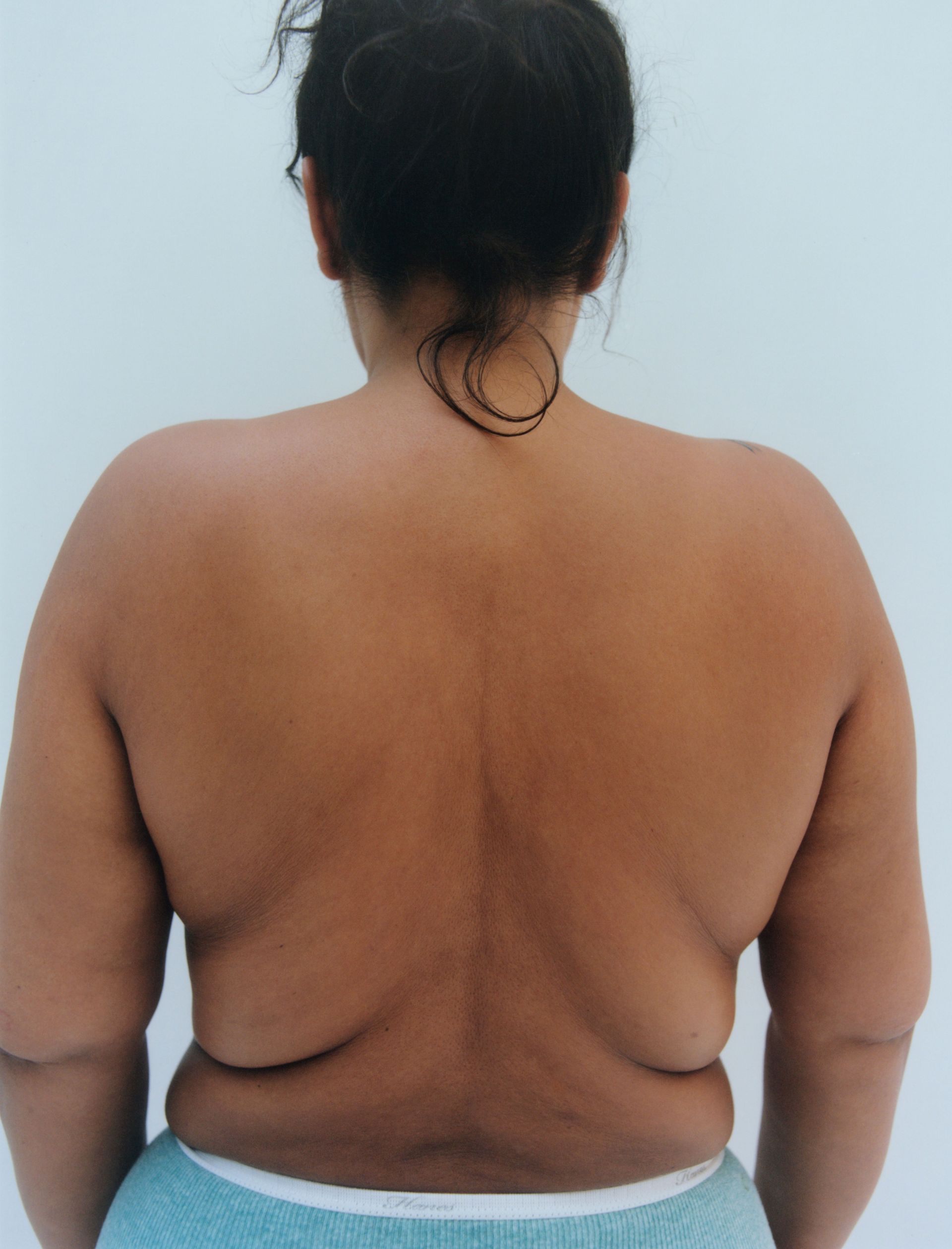 Paloma Elsesser, back to camera