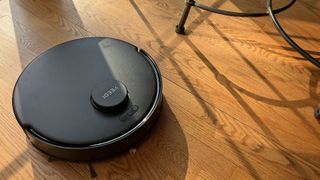 Yeedi C12 Pro Plus robot vacuum sucking up meal cereal