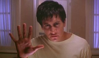 Jake Gyllenhaal puzzles over his reflection in Donnie Darko