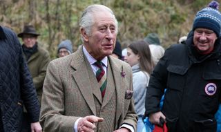 Charles sported what appeared to be heather in his lapel
