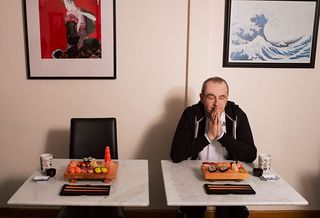 Francis Rossi sits down with a plate of sushi