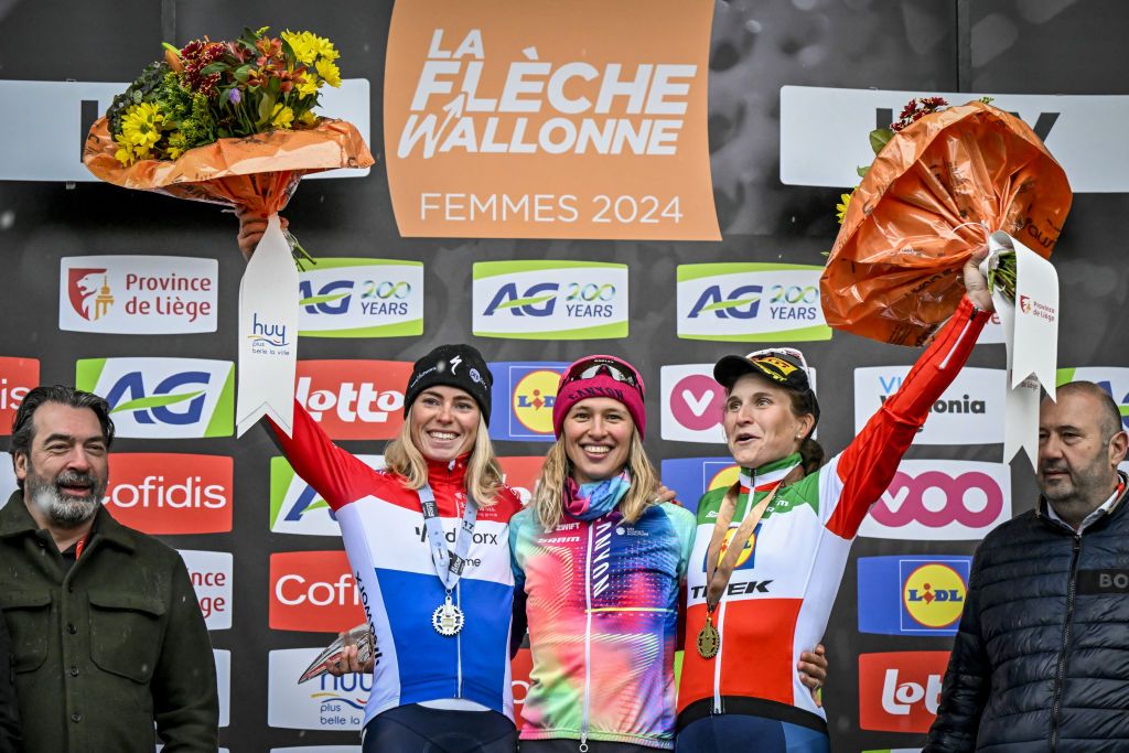 Second-placed Dutch Demi Vollering (2nd L) of SD Worx - Protime, winner Polish Katarzyna Niewiadoma (C) of CANYON//SRAM Racing and third-placed Italian Elisa Longo Borghini (2nd R) of Lidl-Trek celebrate on the podium of "La Fleche Wallonne" women's race in Huy on April 17, 2024. (Photo by ERIC LALMAND / Belga / AFP) / Belgium OUT