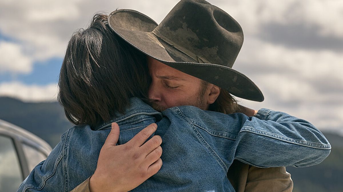 Kelsey Asbille as Monica Long and Luke Grimes as Kacey Dutton embrace in Yellowstone season 5, part 2