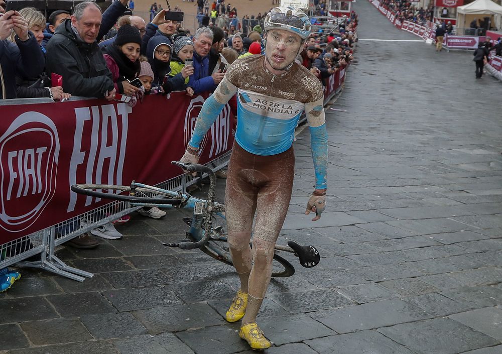 An AG2R La Mondiale rider struggles at the finish of Strade Bianche in Siena