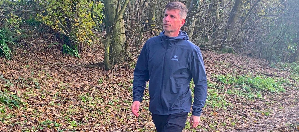 Man wearing Arc&#039;teryx Gamma Lightweight Hoody in the woods