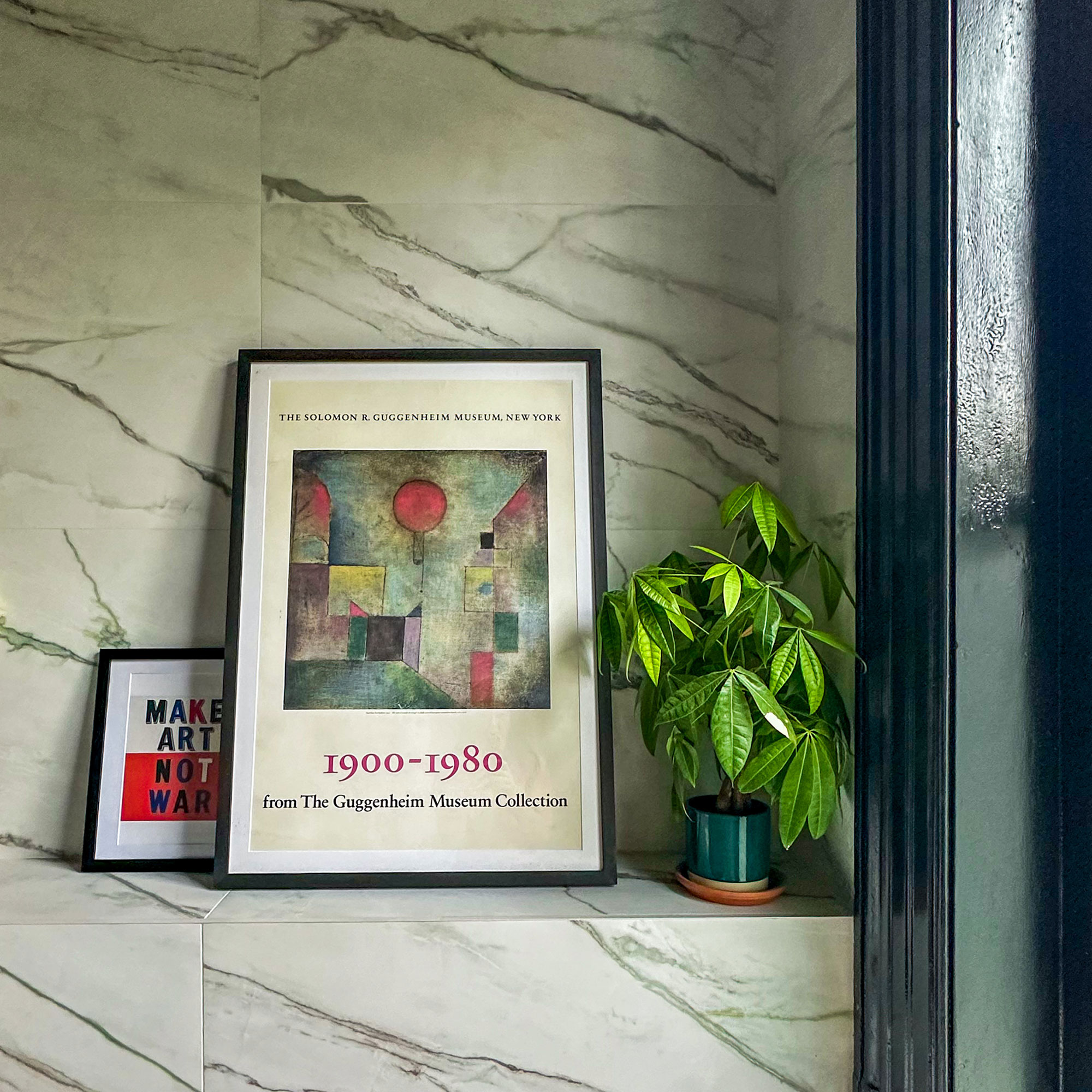 Tiled walls and shelves with artwork