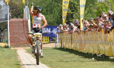 Kevin Evans kisses the ruby stone tattoo on his bicep in a gesture to his daughter on his way to winning the MTN Ride Crater Cruise for the fourth year in succession.