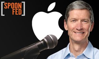 Tim Cook With Apple Logo in Background and Microphone Pointed At Him