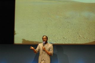 Musical artist will.i.am addresses a crowd of students at NASA's Jet Propulsion Laboratory in Pasadena, Calif., where his new single, "Reach for the Stars," was beamed down from the Curiosity Mars rover and broadcast to the live audience on Aug. 28, 2012.