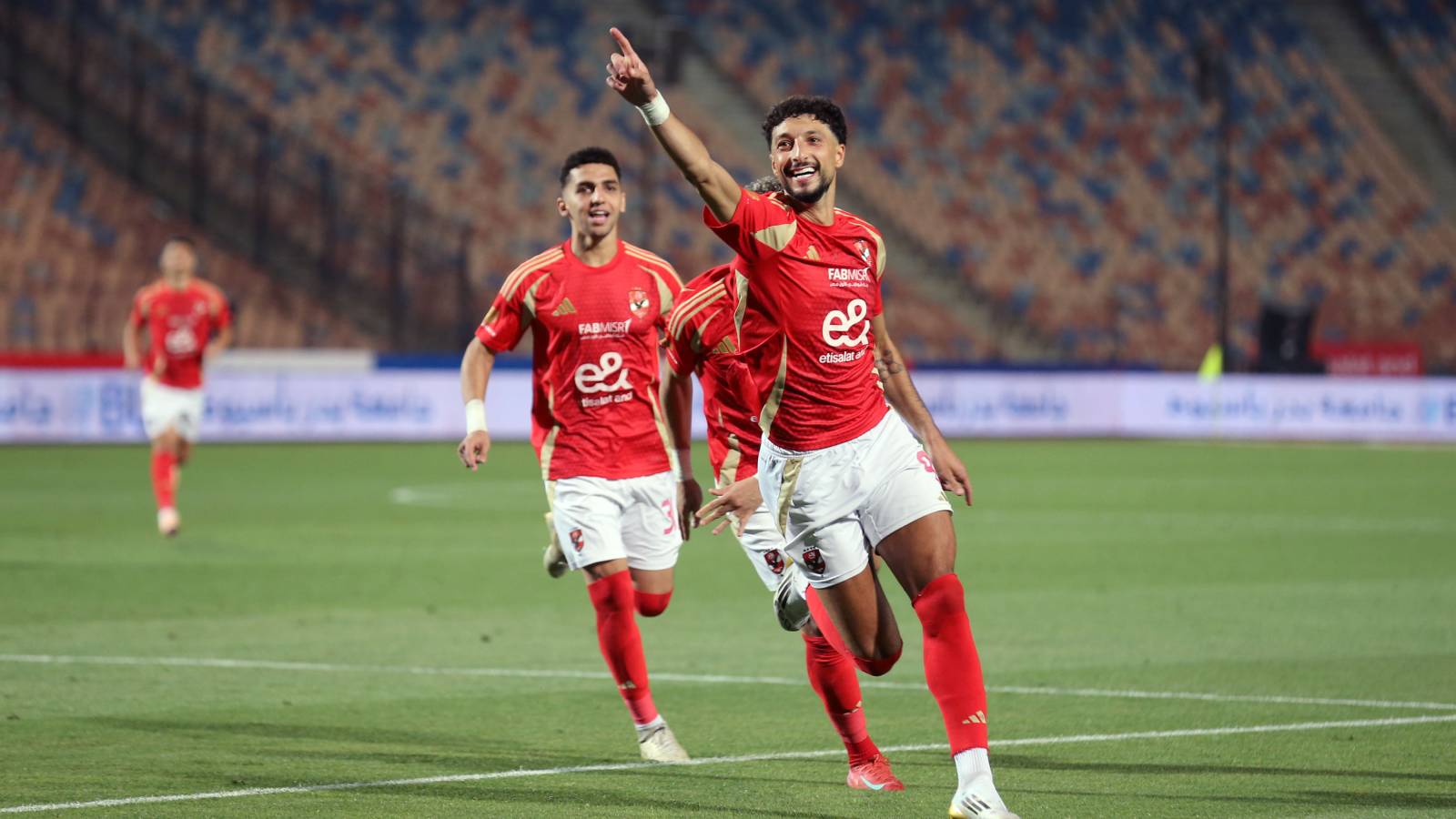 Al-Ahly player Wissam Abu Ali celebrates after scoring during the Al-Ahly match against Pharco