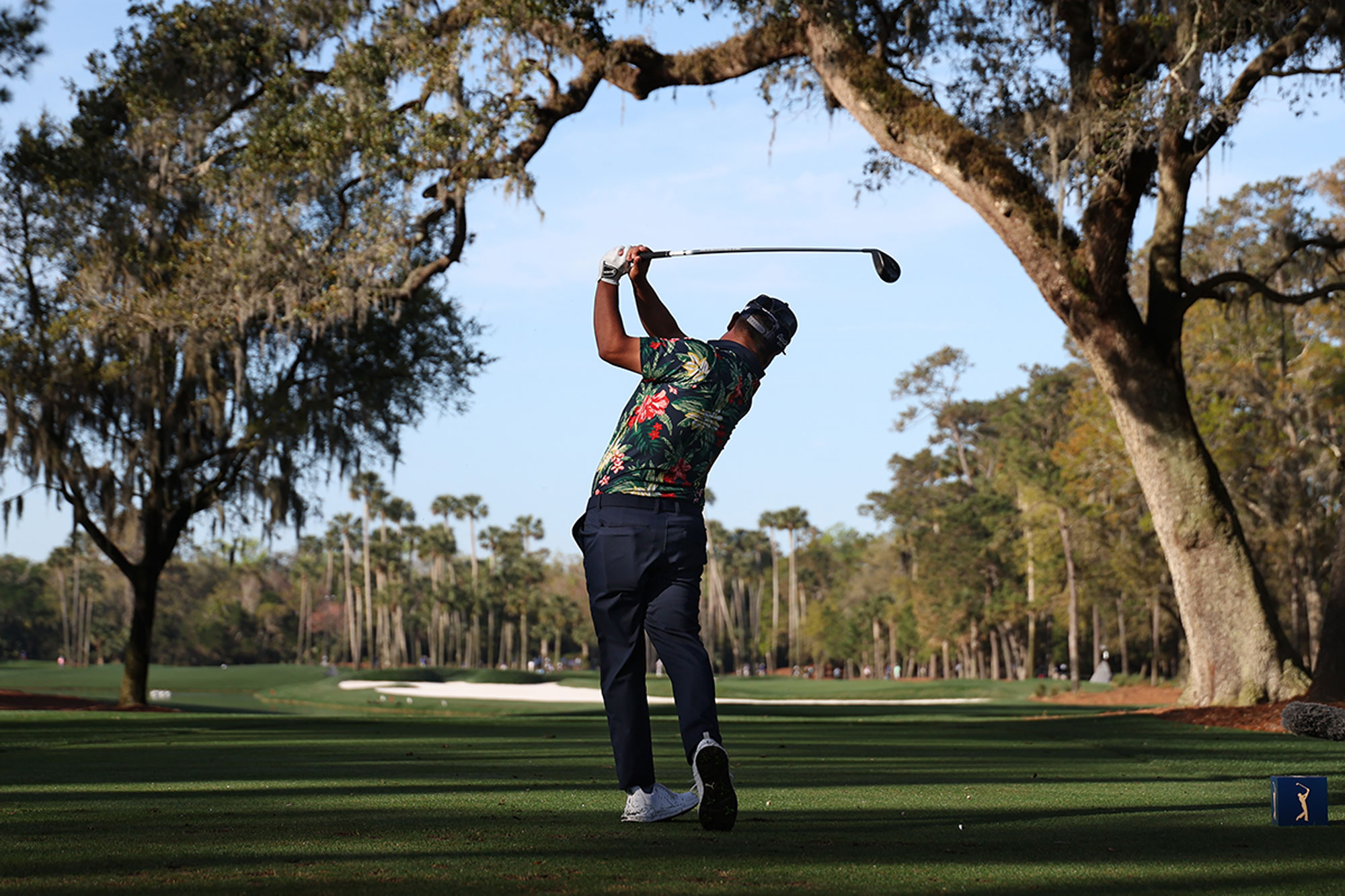 JJ Spaun in the perfect finish position after hitting a tee shot with driver at the 2025 Players Championship