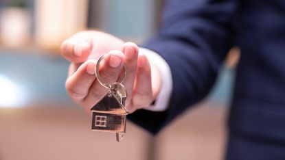 Person holding set of house keys