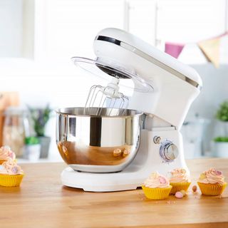 Aldi stand mixer in white on a kitchen counter surrounded by cupcakes
