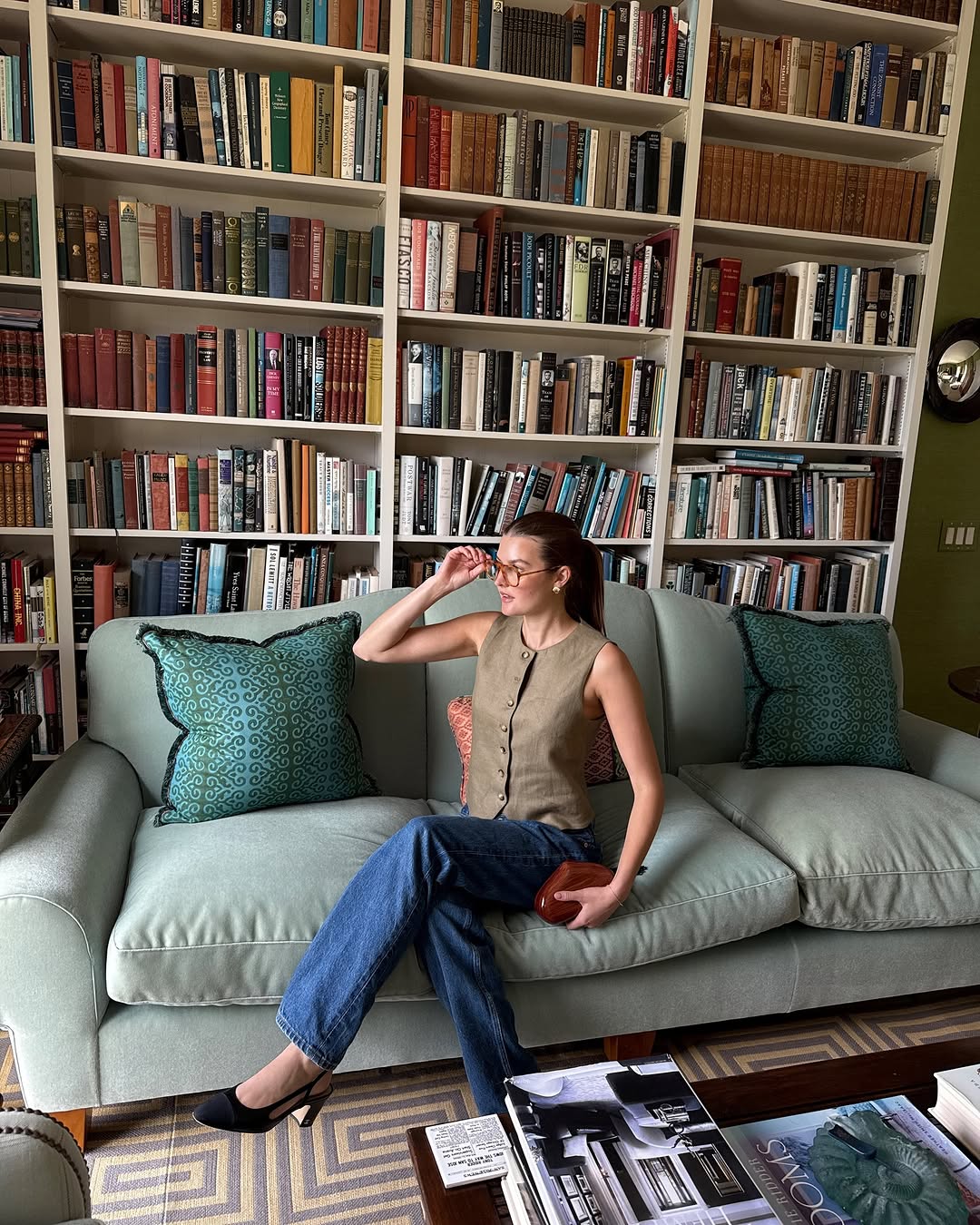 Woman wearing dark wash bootcut jeans fall 2025.