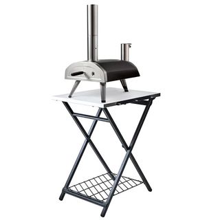 Ooni folding pizza oven table with pizza oven on top.