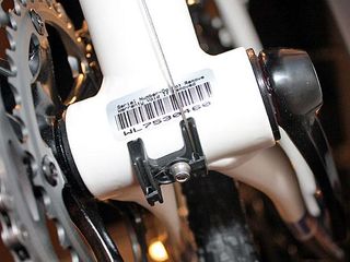 Press-fit bottom bracket cups save a few grams and also allow for wider chain stay spacing.