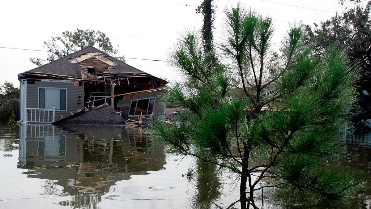 A home with only its second story visible sits destroyed by Hurricane Katrina August 30, 2005 in New Orleans, Louisiana.