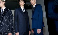 Male models wearing dark blue suits from the Dior SS2015 collection