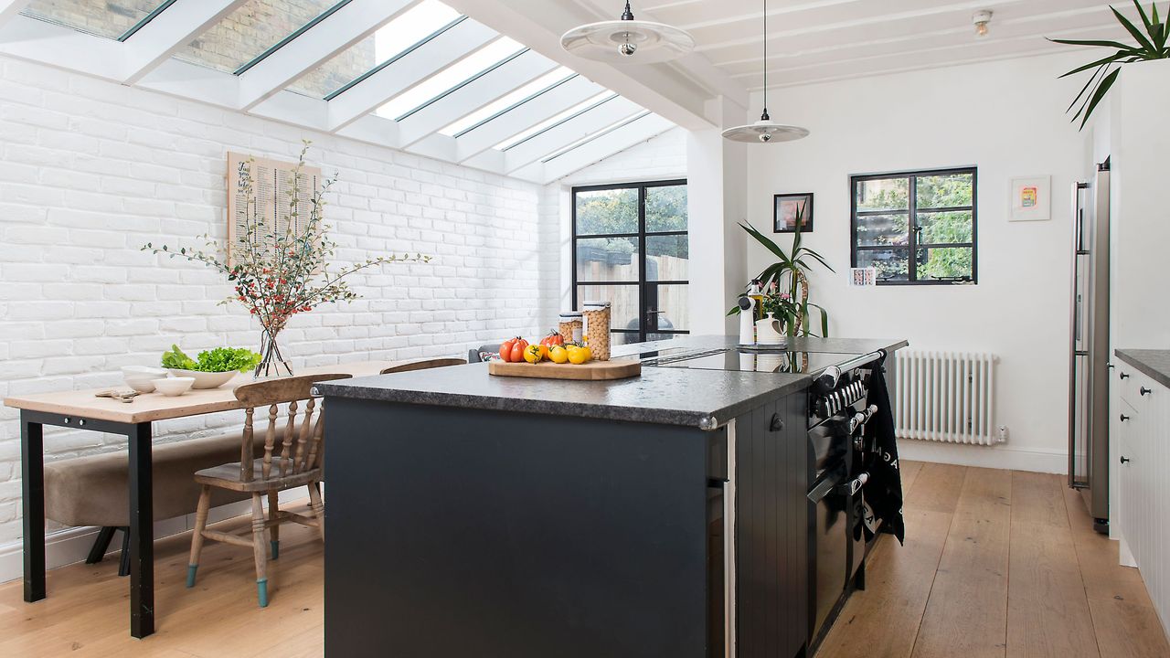 Kitchen dining area in side return extension, with rooflights above