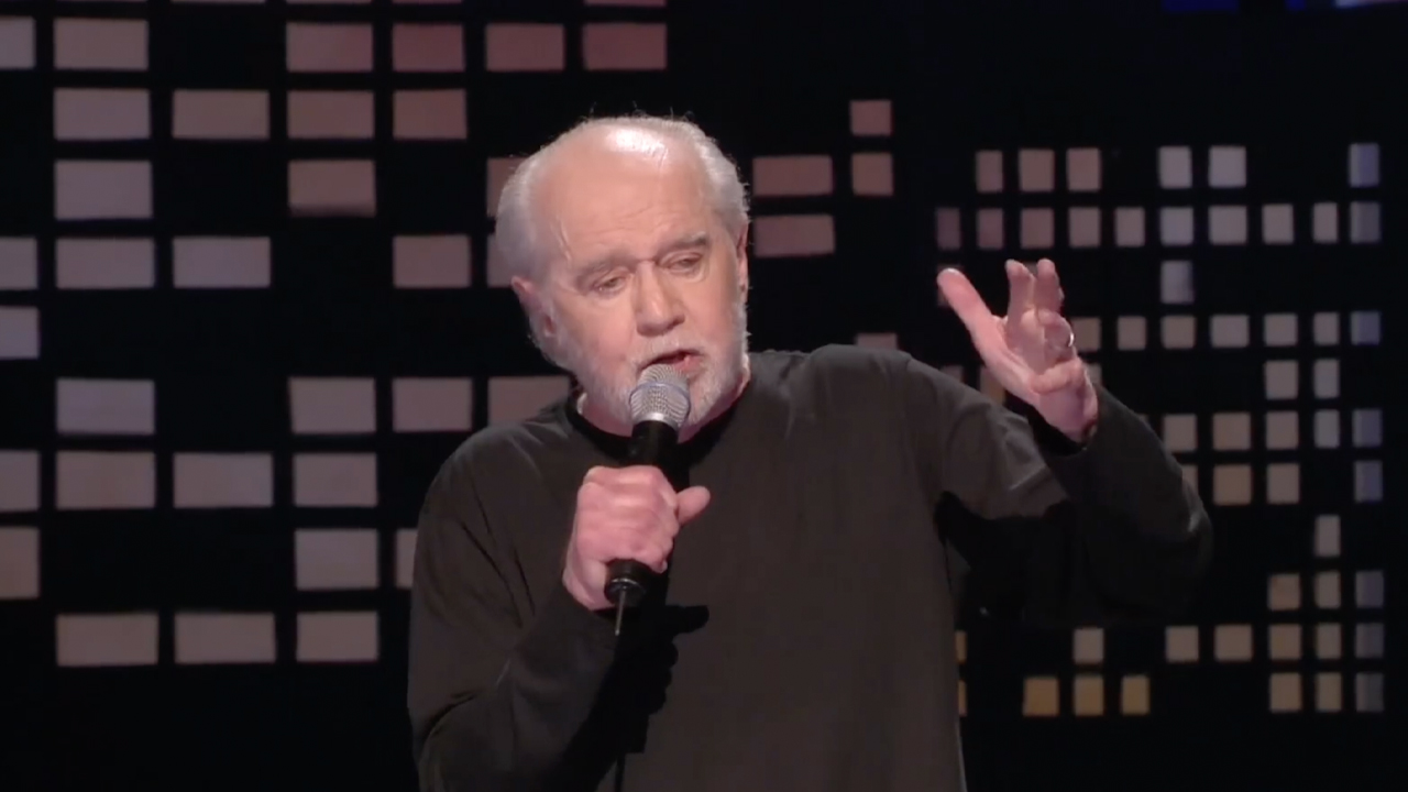 George Carlin, late in life, black shirt performing his last standup special 'Its Bad For Ya,' footage from HBO's George Carlin's American Dream.