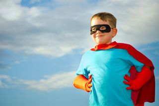 Boy dressed as a superhero.