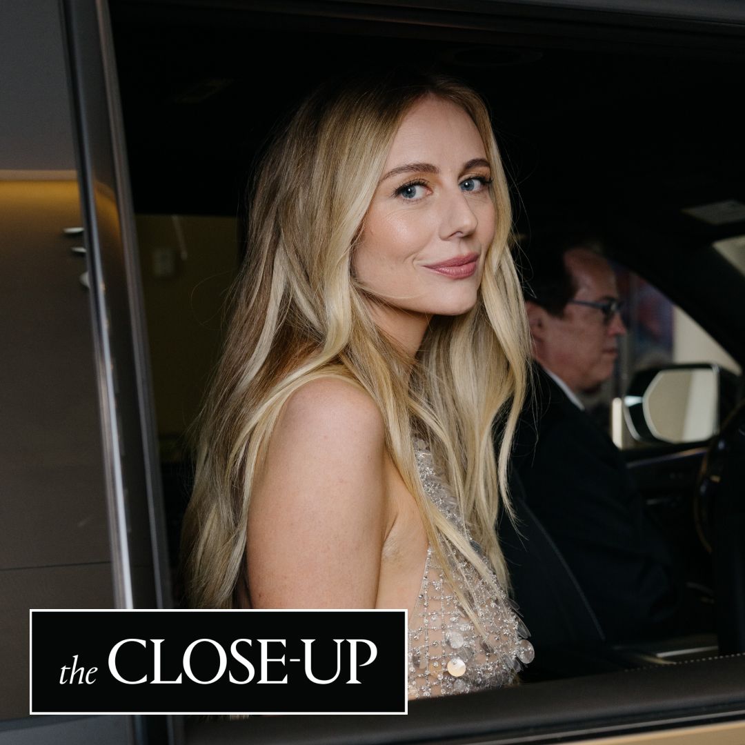 Justine Lupe gets in the car on the way to the 2025 Emmy Awards wearing a Carolina Herrera dress