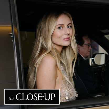 Justine Lupe gets in the car on the way to the 2025 Emmy Awards wearing a Carolina Herrera dress