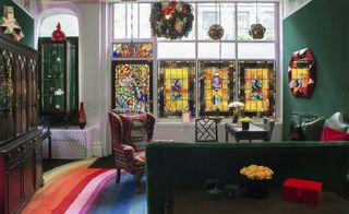 The eclectic space features velvet walls