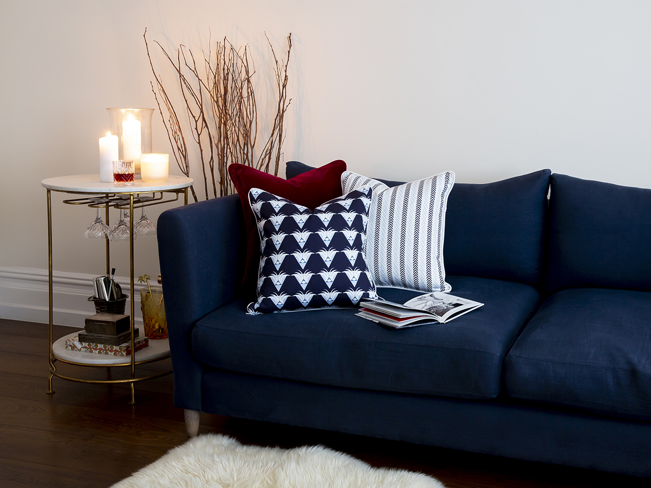 living room with blue sofa