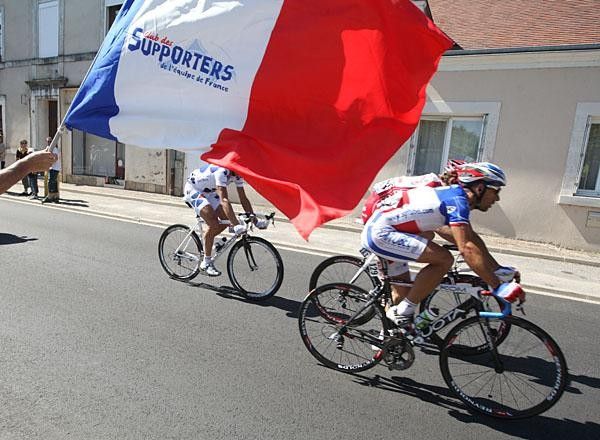 Fans wave the French flag in support of Nikolas Vogondy, the French champion, who was in the break.