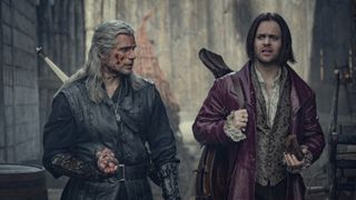 (L to R) Henry Cavill as Geralt and Joey Batey as Jaskier in The Witcher