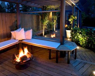 wooden deck with seating and fire pits